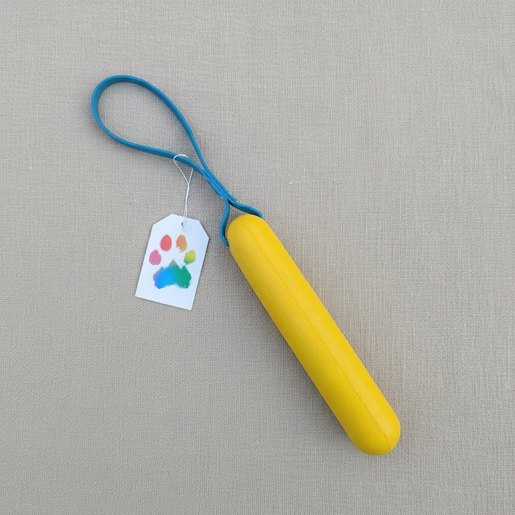 A yellow foam buoy dog tug toy with a blue BioThane handle