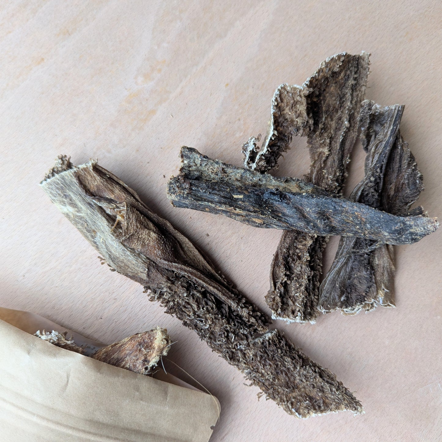 Dried beef tripe on a wood surface