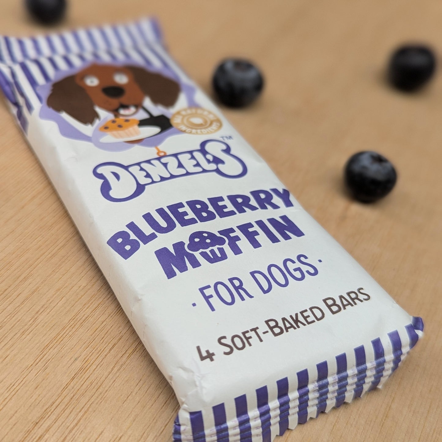 A close up of the words "blueberry Muffin for dogs, 4 soft-baked bars"