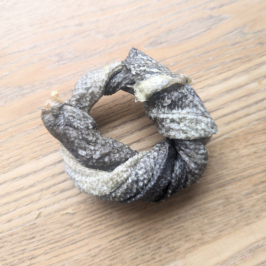 one cod skin doughnut chew. The cod skin is twisted in a doughnut shape with a hole in the middle
