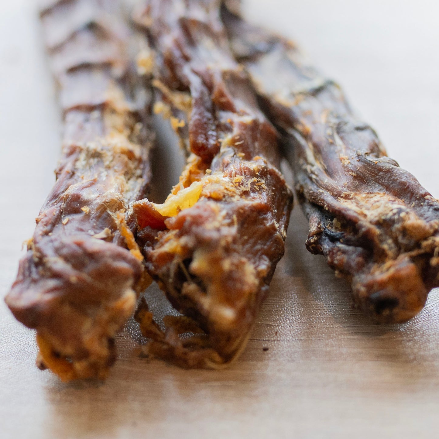 a close up of the ends of three duck necks