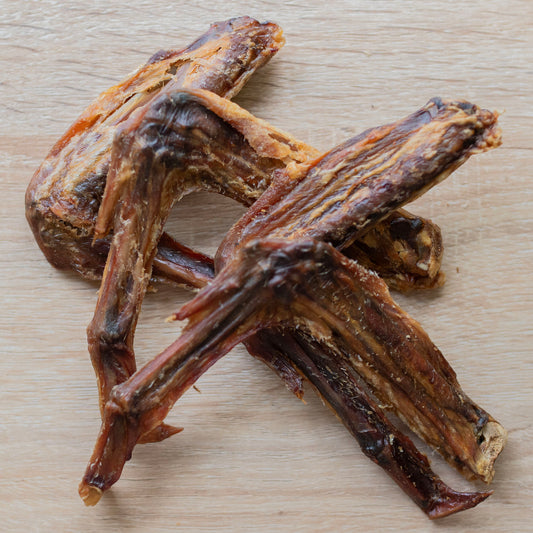 three duck wings intermingled on a table