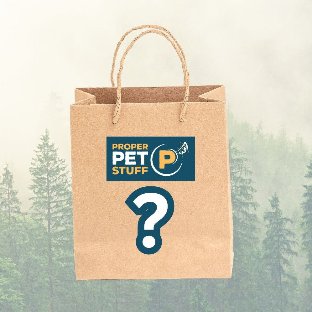 Brown paper bag with 'Proper Pet Stuff' logo and question mark on a forest background