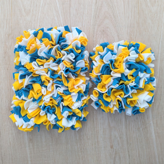 the large snuffle mat is on the left and the small snuffle mat is on the right