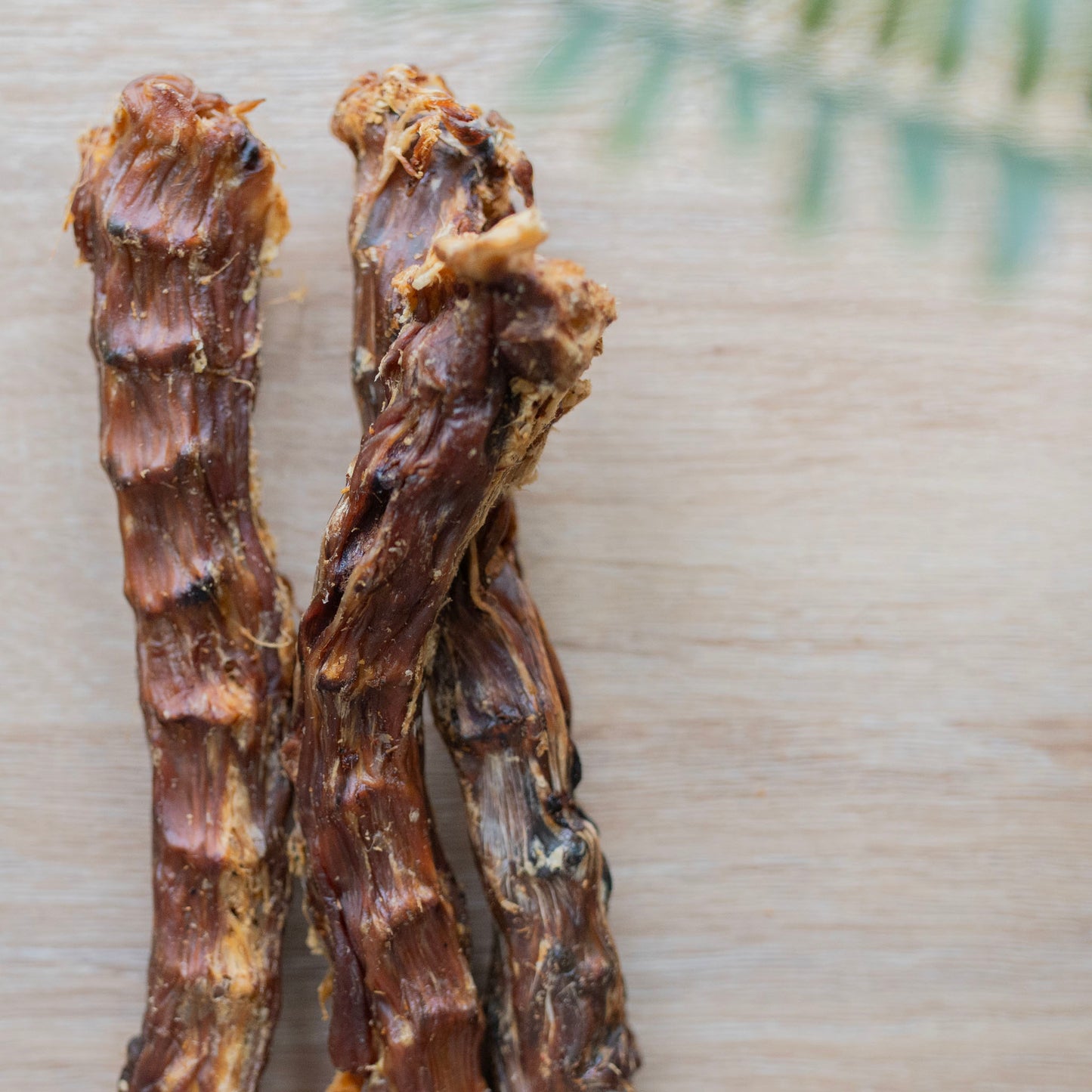 three duck necks side by side on the left portion of the photo