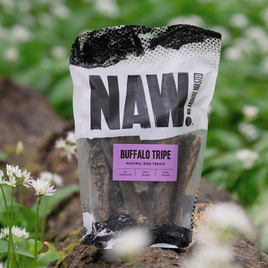 Package of NAW Buffalo Tripe natural dog treats with a natural background