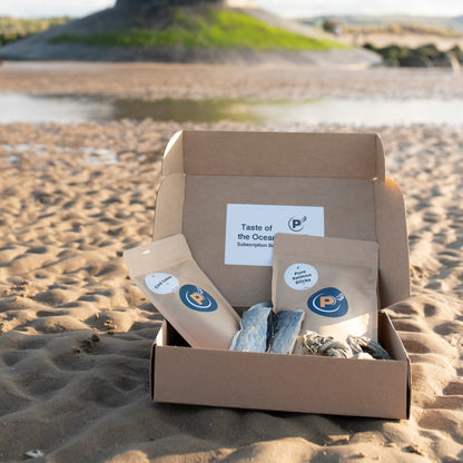 Box with 'Taste of the Ocean' products on a beach