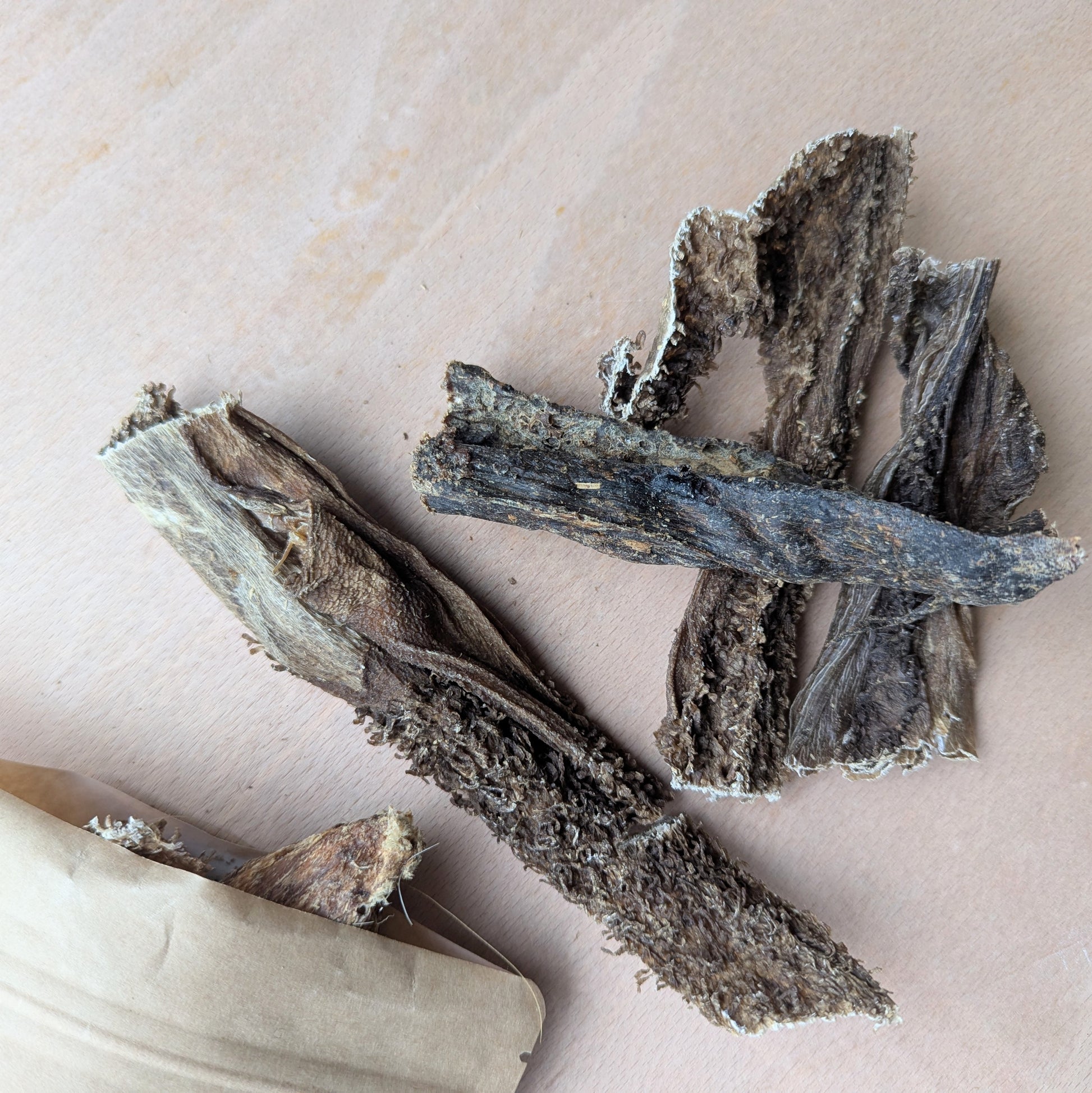 Dried beef tripe on a wood surface