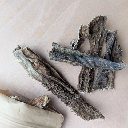 Dried beef tripe on a wood surface