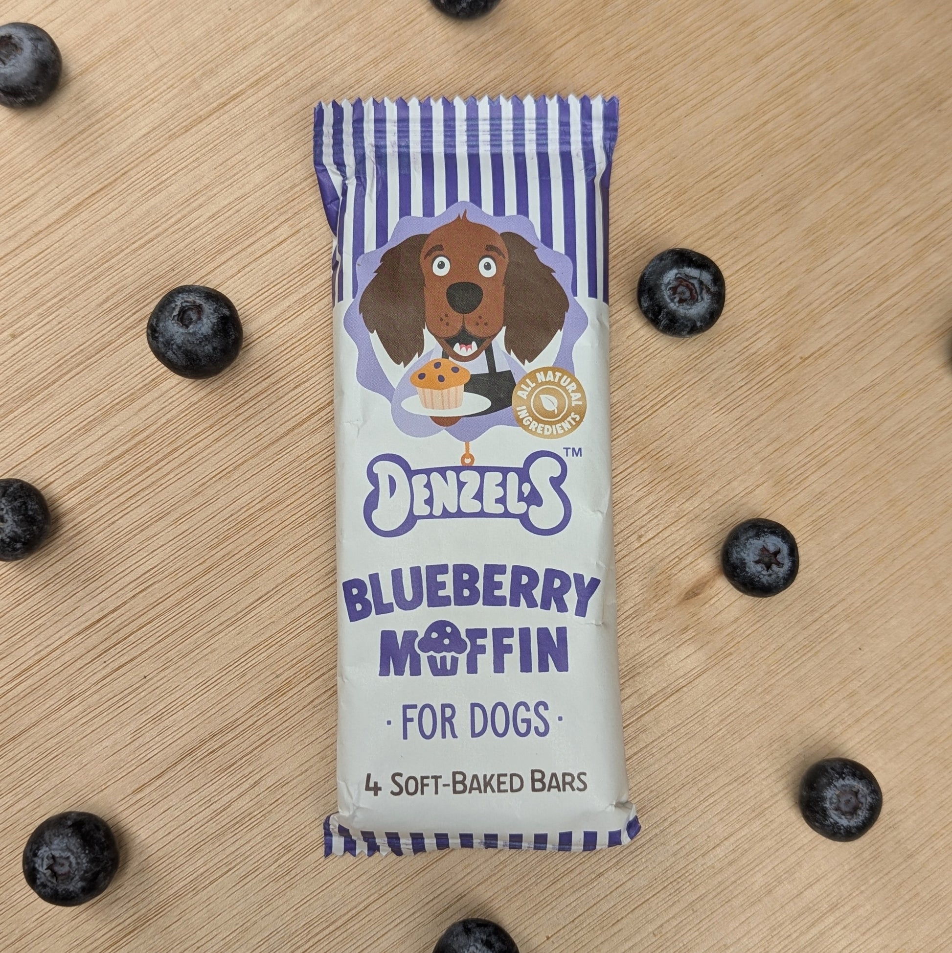 blueberry flavoured bars in blue and white striped packaging. The bars can not be seen. There are blueberries around the product