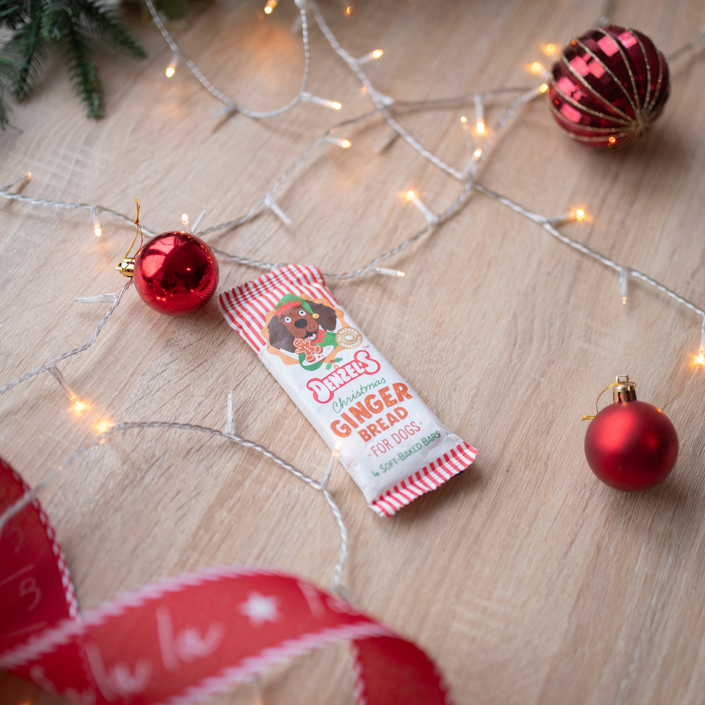 gingerbread flavoured dog chew barsin red and white striped packaging. The bars can not be seen, only the packaging.