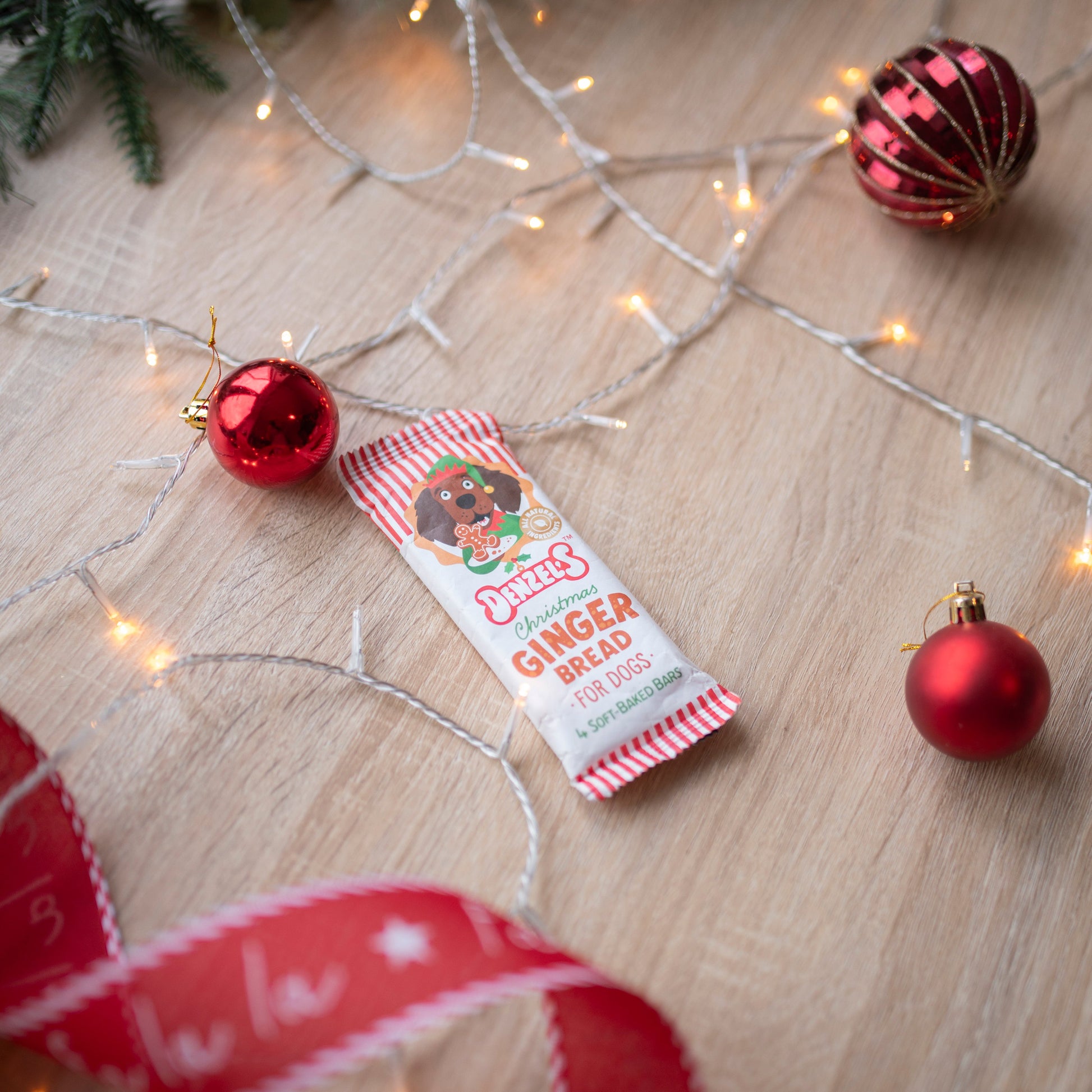 gingerbread flavoured dog chew barsin red and white striped packaging. The bars can not be seen, only the packaging.