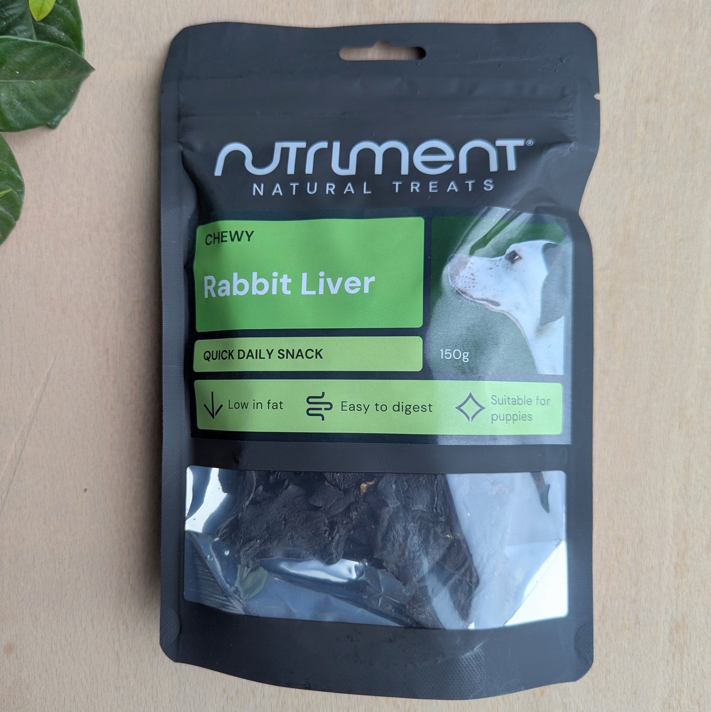 Nutriment natural treats package for rabbit liver on a wood surface