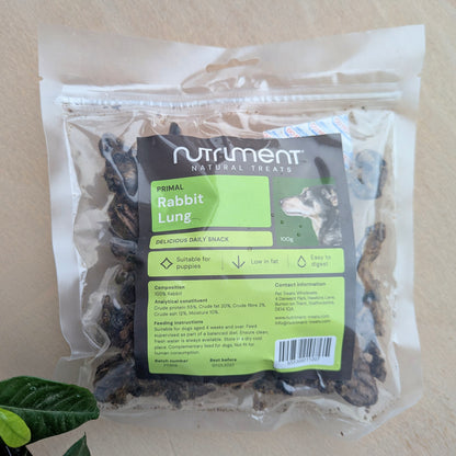 Package of Nutrlment Primal Rabbit Lung treats on a beige background